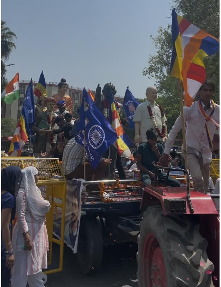 A tractor, with statues of Buddha, Ashoka, Mahatma Phule, Babasaheb Ambedkar, Manyavar Kanshiram, ‘insurging’ its way into Parliament Street